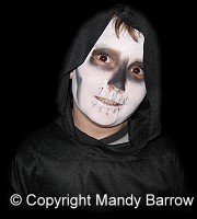 image: boy dressed up as ghoul